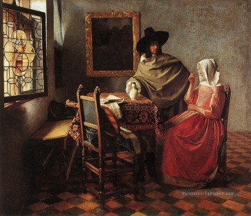 Une femme buvant et un gentilhomme baroque Johannes Vermeer Peinture à l'huile